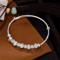 kanona-bracelet-jonc-ferme-ajustable-argent-massif-avec-charms-pour-femme-perles-et-roses-vue-dessus
