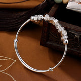 kanona-bracelet-jonc-ferme-ajustable-argent-massif-avec-charms-vue-profil