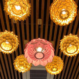    luminaire-suspension-en-bois-an-nhon-rose-ambiance-allume-vue-dessous