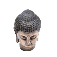 statue-tete-de-bouddha-gautama-dessus
